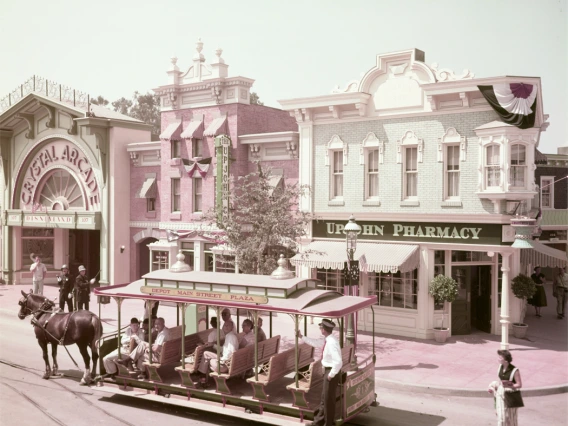 A horse-drawn trolley passes the Upjohn Pharmacy