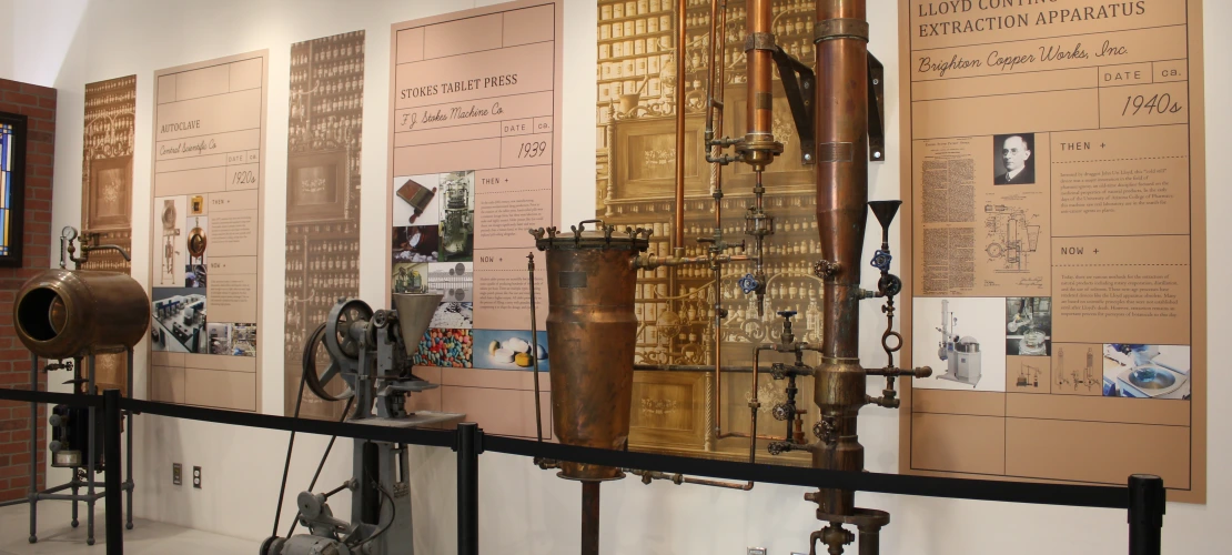 large vintage medical equipment is lined up against a wall