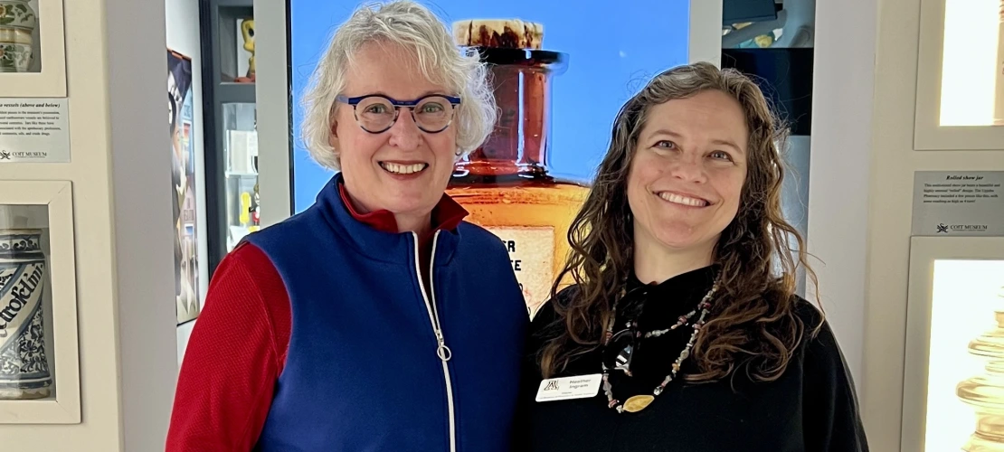 Greeter and Guide Martie Fankhauser stands with Director Heather Ingram in the museum