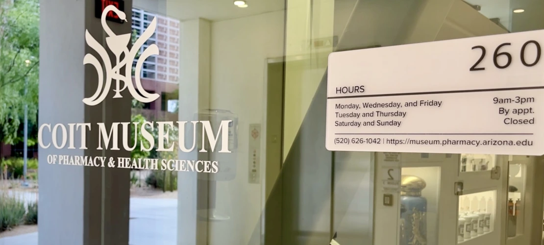 Museum entrance showing hours