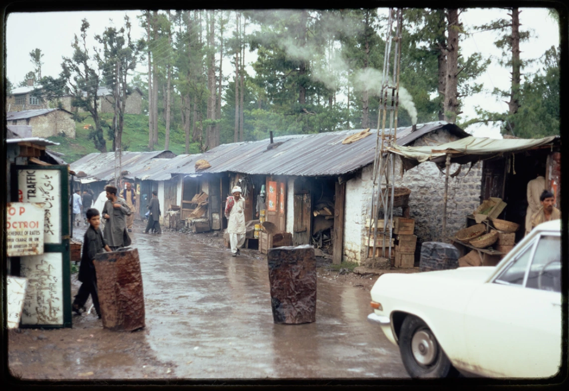 9-11-72 Pakistan, Entering the Punjab, Barrels served as gate posts (Pakistan)