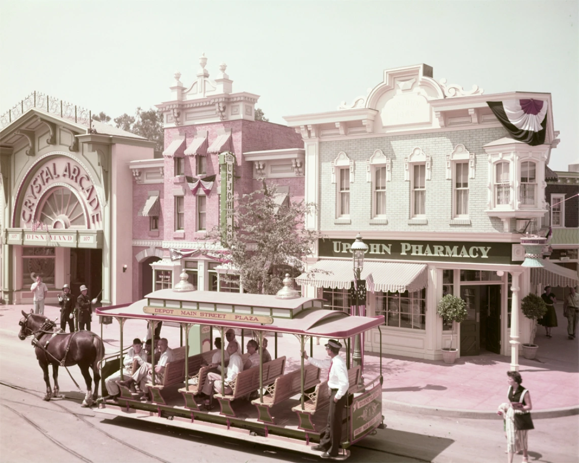 A horse-drawn trolley passes the Upjohn Pharmacy