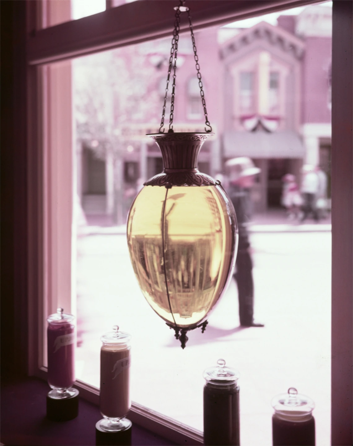 A show globe hangs in the window of the Upjohn Pharmacy