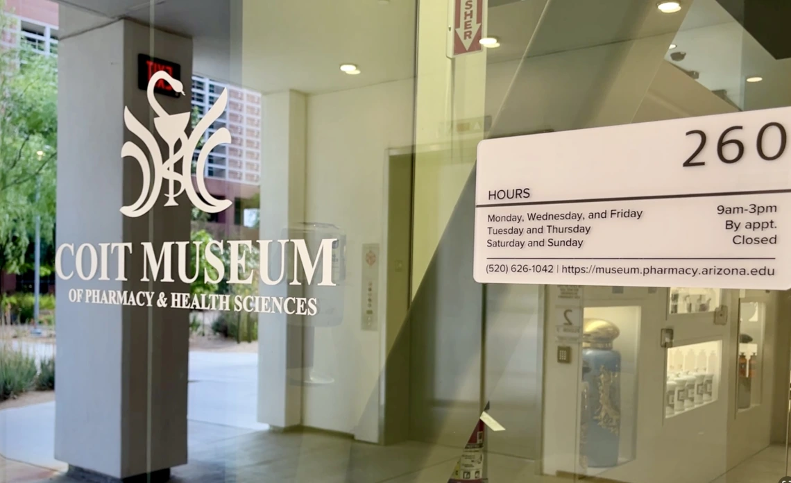 Museum entrance showing hours